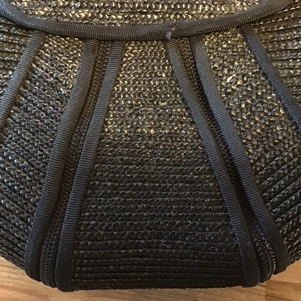 Magid woven grass black clutch and one no brand floral print wallet.